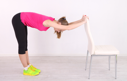 Client doing exercise Holding on to Chair